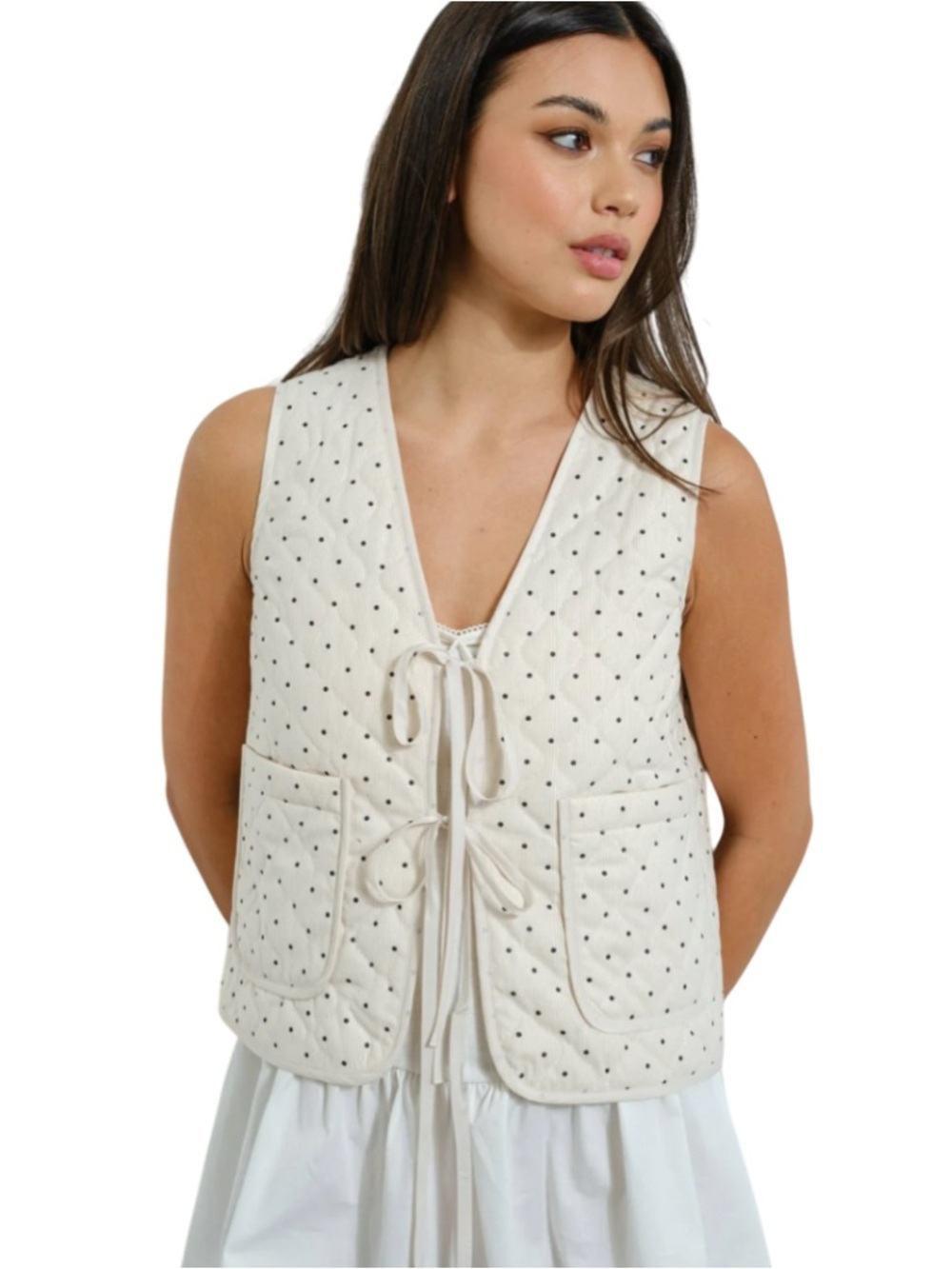 Pretty Garbage cream-colored quilted vest with a polka dot pattern